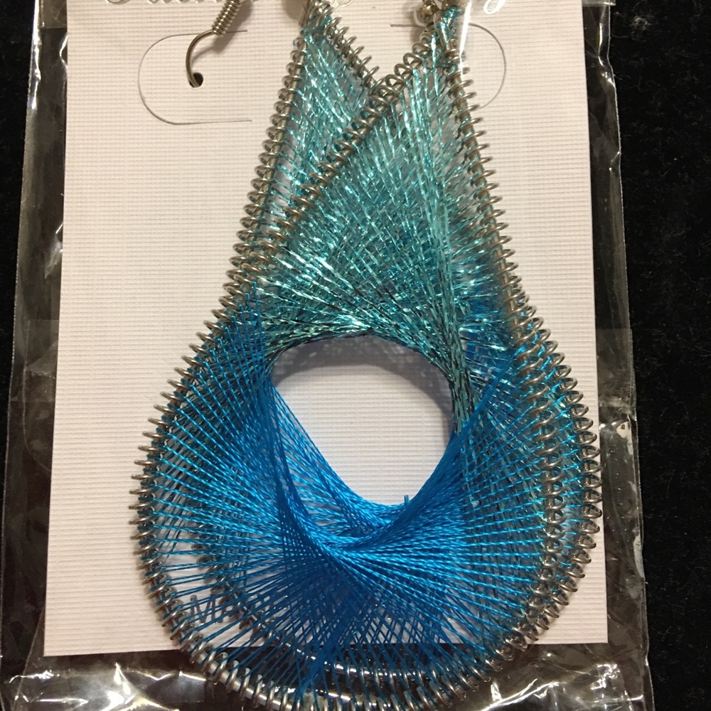 Woven silk earrings, new never worn, in the original packaging, length 3 inches